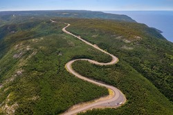 Aerial view of the winding Cabot Trail road from MacKenzie Mountain in Cape Breton Island, Nova Scotia.