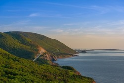 West side of Cabot Trail in Cape Breton Highlands National Park, Nova Scotia, Canada during a summer sunset.
