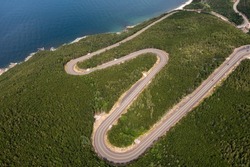 View from above of aportion of the winding Cabot Trail road from MacKenzie Mountain in Cape Breton Island, Nova Scotia.
