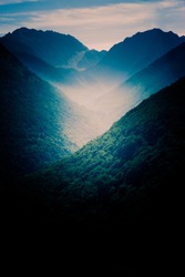 Dark landscape with mountains at sunset over Pyrenees. Perfect background for iphone, smartphone or tablet
