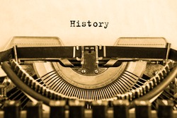 History typed on an vintage typewriter, old paper. 