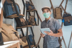 sick male business owner keep working and wear face masks