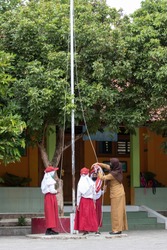 Indonesian elementary student do flag raising preparation in school