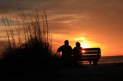 Elder couple watching sunset