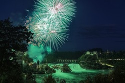 Celebrating the Swiss Nationa Day an First August with firework over the Rhinefalls in the evening