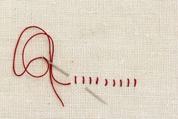 Stitches and needle - proverb: One stitch in time saves nine.