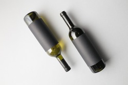 Top view of two wine bottles, mixed with wines type and a bottles colors