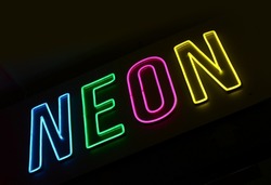 Neon, multicolored neon lettering. The word neon is made of flexible cold neon