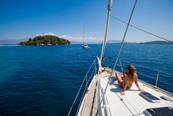 Young woman Sailing On Yacht in Greece 