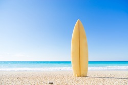 Surf board in the sand at the beach