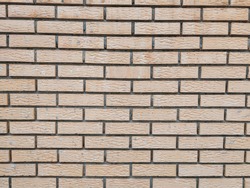 Modern rock stone wall background made of bricks on a wall of the building with rough texture and interesting antique retro natural pattern