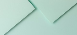 Minimal geometric shapes and lines in light green color. Abstract monochrome creative paper texture banner background