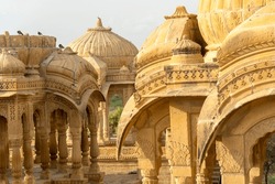 The royal cenotaphs of historic rulers, also known as Jaisalmer Chhatris, at Bada Bagh in Jaisalmer, Rajasthan, India. Cenotaphs made of yellow sandstone