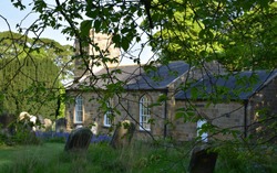 Beautiful historic stone church and graveyard in Northern England.