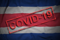 Costa Rica flag and red Covid-19 stamp. Coronavirus 2019-nCov outbreak