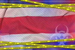 Costa Rica flag and Covid-19 quarantine yellow tape. Coronavirus or 2019-nCov virus concept