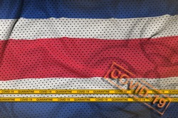 Costa Rica flag and orange Covid-19 stamp with border tape. Coronavirus or 2019-nCov virus concept