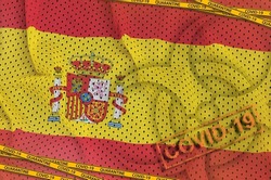 Spain flag and Covid-19 biohazard symbol with quarantine orange tape and stamp. Coronavirus or pandemic 2019-nCov virus concept