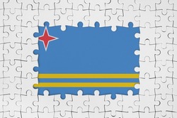 Aruba flag in frame of white puzzle pieces with missing central parts