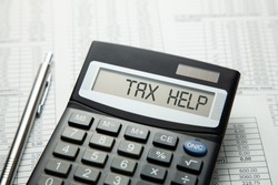 Tax help. On display of calculator is written tax help
