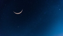 Amazing Crescent Moon on dark blue night sky background.Universe filled with stars, nebula and galaxy with noise and grain.selection focus.