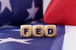 American economy and business concept. The US flag has cubes with the inscription - FED