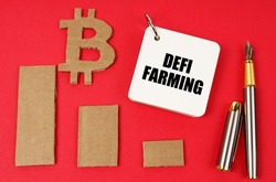 Business and bitcoin concept. On a red surface lie a bitcoin symbol, a graph, a pen and a notepad with the inscription - DEFI farming