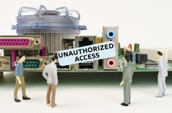 Technology and computer concept. Figures of people are standing near the motherboard and looking at the sticker with the inscription - Unauthorized Access
