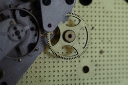 Large gear in the clock. Clockwork inside. Detail of the clockwork.