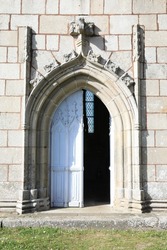 Historic door of a chapel in Brittany, France