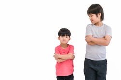 Short child boy in red t shirt and tall child boy in white t shirt standing arms crossed and looking face isolated on white background. Big and small kid concept at be friends. Different boy at tall.