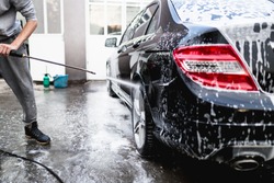 Car washing. Cleaning Car Using High Pressure Water. 