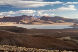 Lago Morejon with Volcano Uturuncu in the background at the altiplano in Bolivia