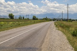 Old asphalt road in the foothills