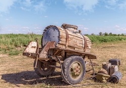 Old abandoned water barrel on wheels
