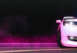 Sedan car and pink smoke on the asphalt road at night,copy space
