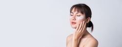Banner, Portrait posing Asian woman applying patches mask under eyes for anti wrinkles and eye dark circles.