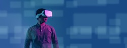 Young Asian man wearing VR headset for entertainment in the metaverse. Augmented reality. Future digital technology game and entertainment. Metaverse technology concept.