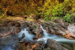 The waterfall deep in the forest in a village located in Kuala Kangsar, Perak Malaysia in slow shutter mode.