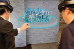 industry smart city technology  concept, civil engineer,architect (blurred) use augmented mixed virtual reality technology to see construction,building for design, analysis,diagnose,process in 3d