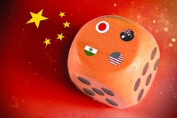 japan,australia,usa and india  countries flags paint over on wooden dice. chinese flag paint on background.