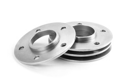 Aluminum wheel spacers. Four through spacers. Isolated on a white background.