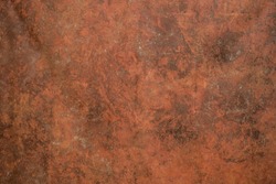 Red texture painted on canvas. Artist red primed cotton mottled grunge background.