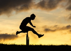 silhouette of an athlete in hurdling in track and field