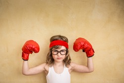 Funny strong child. Girl power and feminism concept