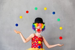 Let's celebrate! Funny kid clown. Child playing at home. 1 April Fool's day concept