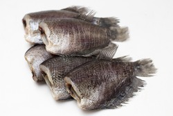 Close up of Dried Salid Fish or 
Gourami Fish Isolated White Background.