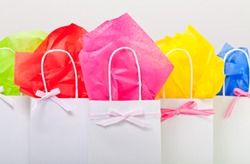 gift bags adorned nicely to represent many things. Hand made with ribbon and tissue paper.