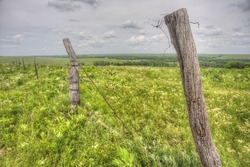 fence in the Flint Hills of Kansas; Tallgrass Prairie National Preserve