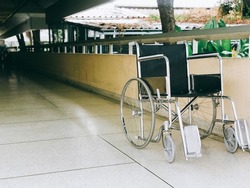 Empty wheelchair on the hallway